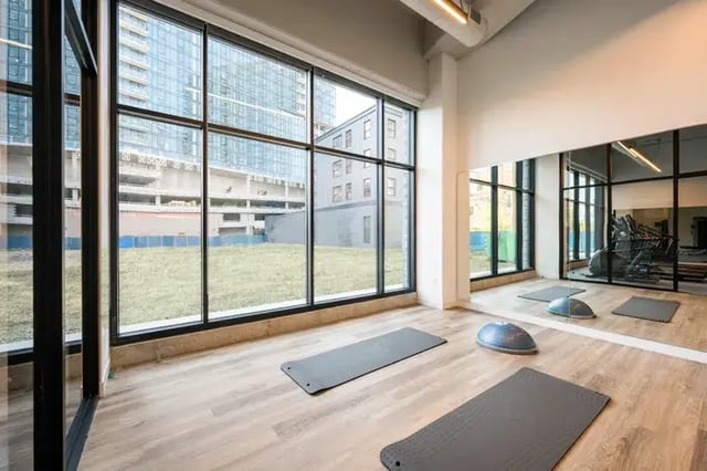 Yoga mats and balance ball in gym at Post Chicago Apartments in Chicago Student Accommodation