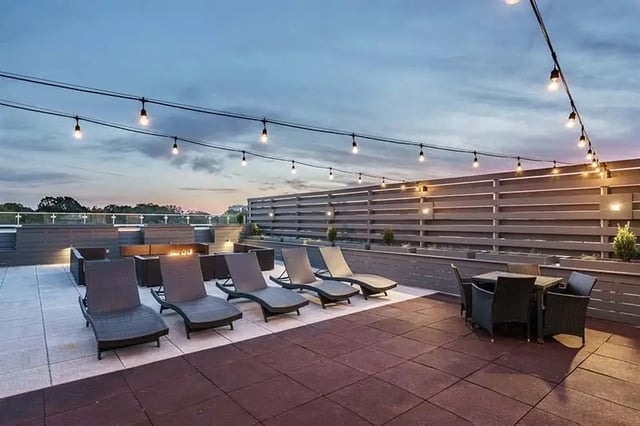 Lounge chairs fire pit dining table outdoor lounge at Shortbread Lofts in Chapel Hill Student Accommodation