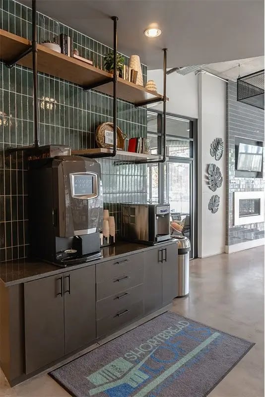 Coffee maker dispenser and cabinetry common area at Shortbread Lofts in Chapel Hill Student Accommodation