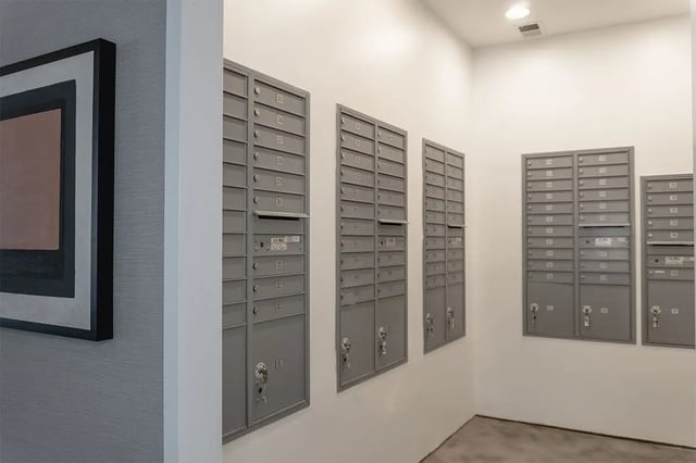 Mailboxes on wall artwork nearby mail area at Shortbread Lofts in Chapel Hill Student Accommodation