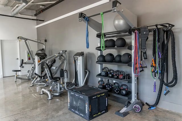 Weight machines kettlebells medicine balls gym area at Shortbread Lofts in Chapel Hill Student Accommodation