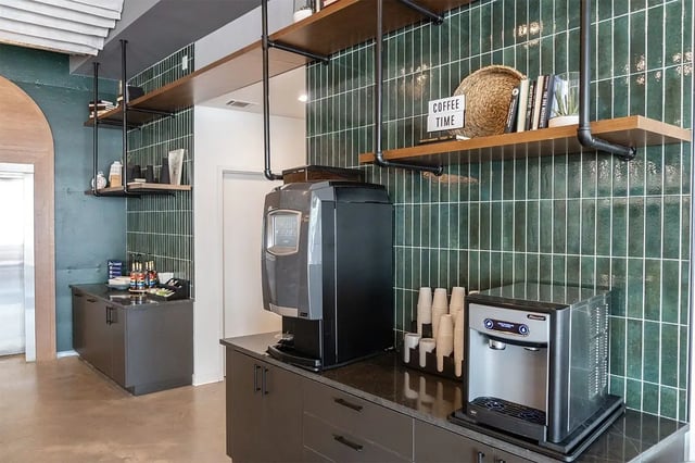 Coffee station with water dispenser and cups kitchen area at Shortbread Lofts in Chapel Hill Student Accommodation