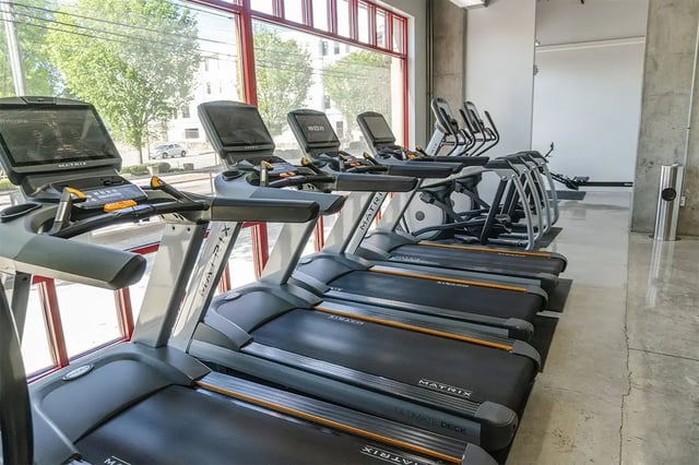 Treadmills and ellipticals in a gym playing area at Shortbread Lofts in Chapel Hill Student Accommodation