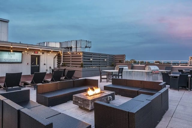 Fire pit lounge area with grills and seating outdoor space at Shortbread Lofts in Chapel Hill Student Accommodation