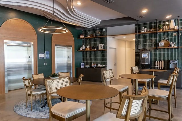 Elevators tables chairs and coffee machine communal area at Shortbread Lofts in Chapel Hill Student Accommodation