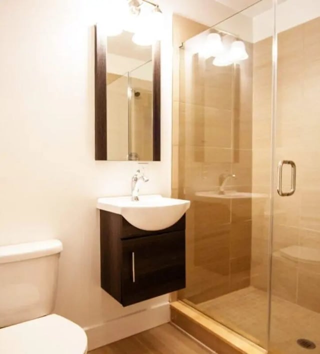 Toilet sink vanity mirror glass shower bathroom at The Eleanor at Walnut Apartments in Philadelphia Student Accommodation