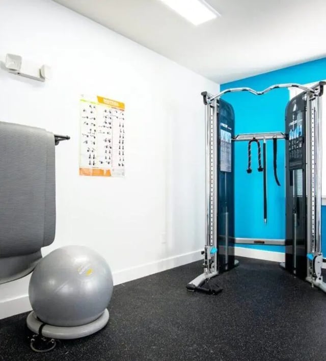 Gym equipment exercise ball and workout chart gym at The Eleanor at Walnut Apartments in Philadelphia Student Accommodation