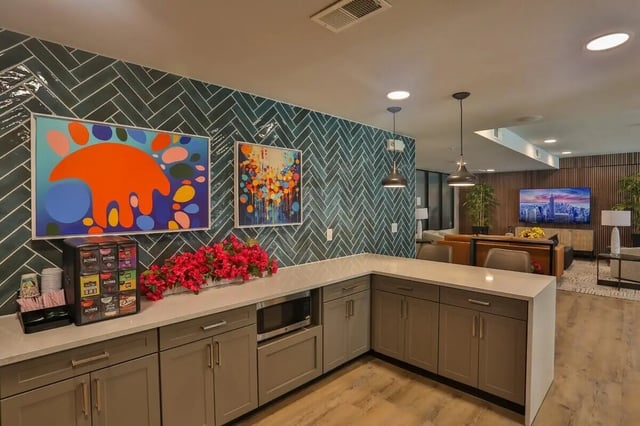 Coffee station and cabinets with artwork kitchen. at Maverick Place Apartments in Arlington Student Accommodation