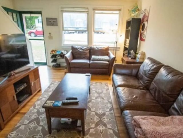 Leather sofas coffee table TV cabinet living room at Lakeside Vista in Ithaca Student Accommodation