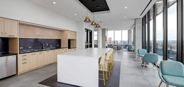 Kitchen island with bar stools and lounge area kitchen at Parc View at Commonwealth in Richmond Student Accommodation