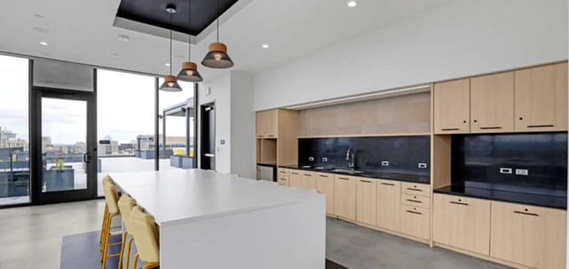 Large island with seating and kitchen counter area. at Parc View at Commonwealth in Richmond Student Accommodation