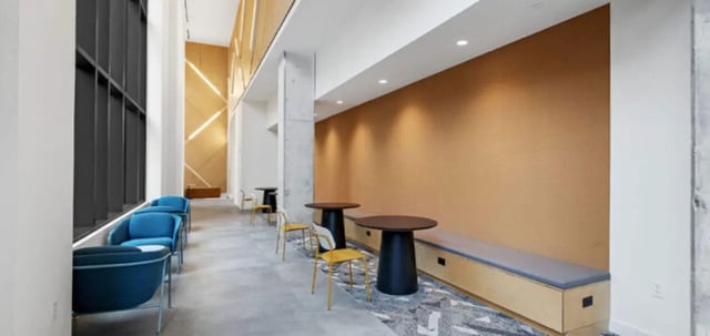 Blue chairs, tables, and bench lounge area at Parc View at Commonwealth in Richmond Student Accommodation