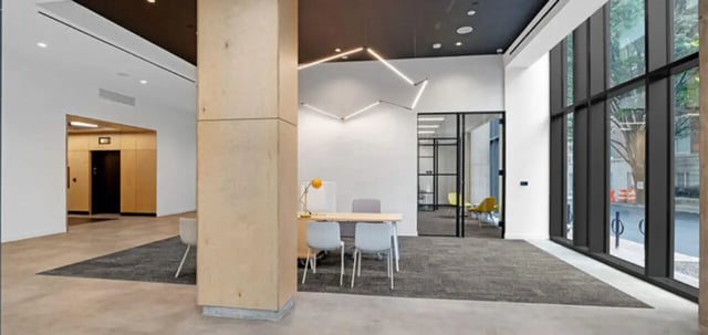 Modern lobby with desk chairs and elevator access lounge at Parc View at Commonwealth in Richmond Student Accommodation
