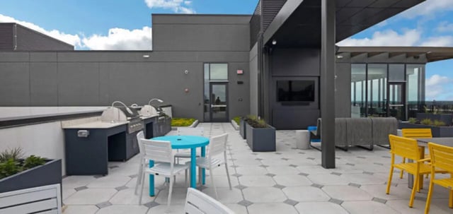 Outdoor kitchen dining area with grills and seating exterior at Parc View at Commonwealth in Richmond Student Accommodation