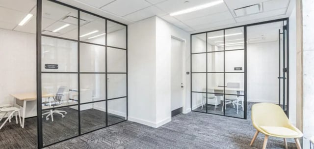 Glass partitioned study rooms with desks chairs living room at Parc View at Commonwealth in Richmond Student Accommodation