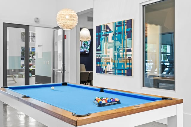 Pool table with balls and abstract art playing area at Venue at North Campus in Tampa Student Accommodation