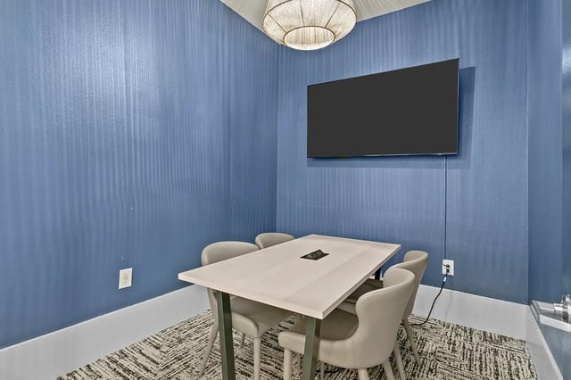 Table with chairs and television study area at Venue at North Campus in Tampa Student Accommodation