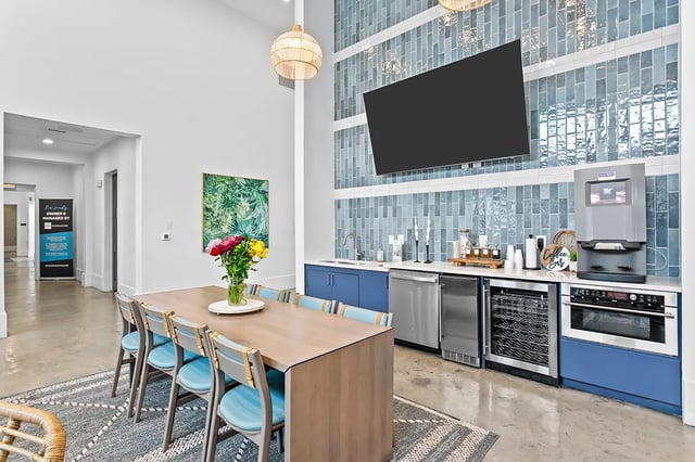 Dining table with chairs kitchen area living area at Venue at North Campus in Tampa Student Accommodation