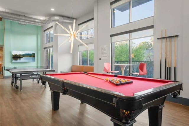 Pool table ping pong table television lounge area Living Room at Signature 1505 in Raleigh Student Accommodation