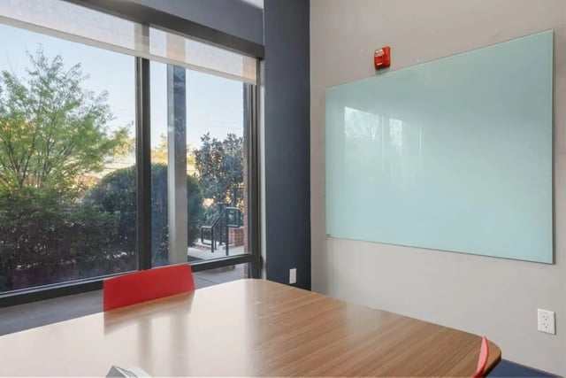 Table whiteboard fire alarm window study area at Signature 1505 in Raleigh Student Accommodation
