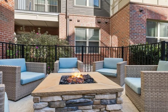 Patio with fire pit and chairs exterior at Signature 1505 in Raleigh Student Accommodation