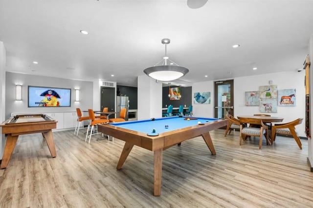 Pool table shuffleboard bar stools television game area at Signature 1909 in Austin Student Accommodation