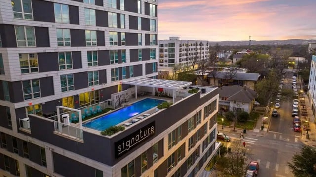 Rooftop pool and lounge chairs exterior at Signature 1909 in Austin Student Accommodation