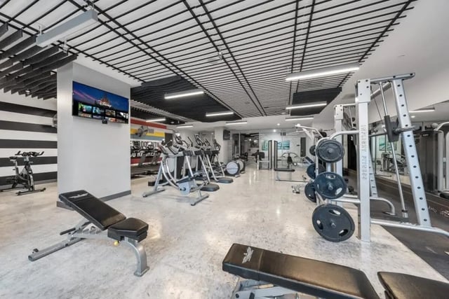 Treadmills exercise bikes weight machines gym equipment fitness center at Signature 1909 in Austin Student Accommodation