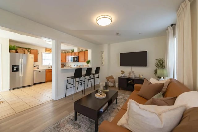 Living room with bar stools and kitchen living room at The Villas at Happy Valley in State College Student Accommodation