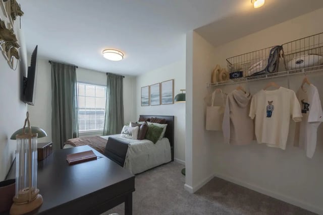 Desk bed closet and shelves bedroom at The Villas at Happy Valley in State College Student Accommodation