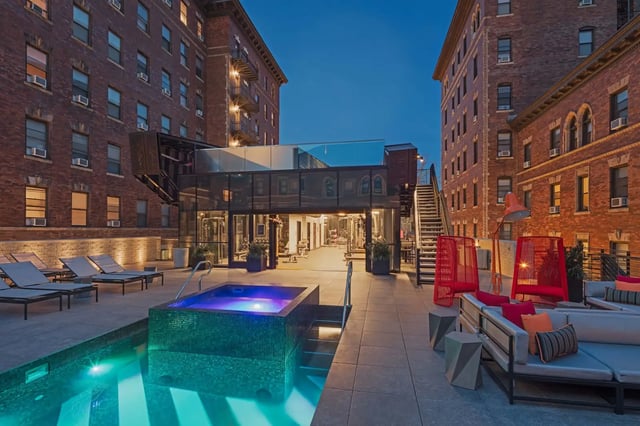 Pool jacuzzi lounge chairs and gym exterior at Hamilton Court in Philadelphia Student Accommodation