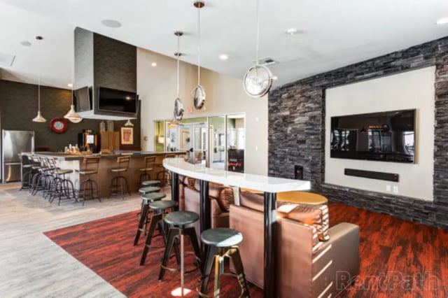 Bar area with stools and couches common area at Stadium View in Bozeman Student Accommodation