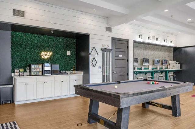 Pool table coffee bar computers living room at Hannah Townhomes & Lofts in East Lansing Student Accommodation