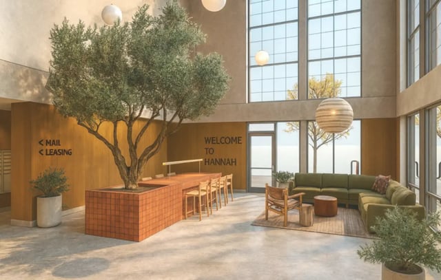 Olive tree reception desk seating area living room at Hannah Townhomes & Lofts in East Lansing Student Accommodation