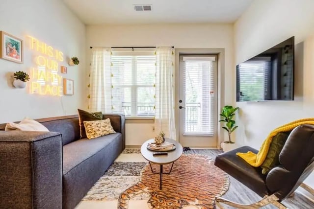 Sofa coffee table and television living room at Signature Hartwell Village in Seneca Student Accommodation