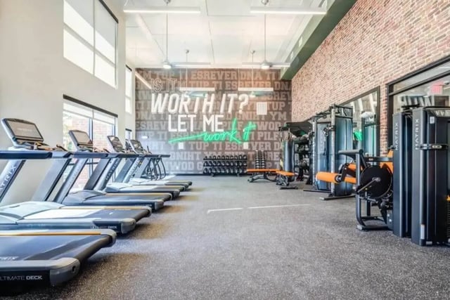 Treadmills weight machines and motivational wall gym at Signature Hartwell Village in Seneca Student Accommodation