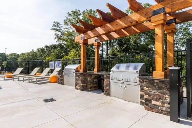 Grills lounge chairs and pergola outdoor entertainment area at Signature Hartwell Village in Seneca Student Accommodation