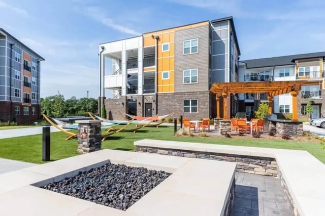 Hammocks fire pit tables chairs exterior at Signature Hartwell Village in Seneca Student Accommodation
