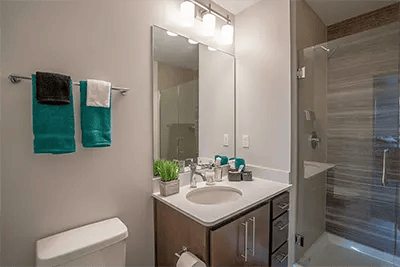 Sink towels toilet shower and vanity bathroom at Landmark on Grand River in East Lansing Student Accommodation