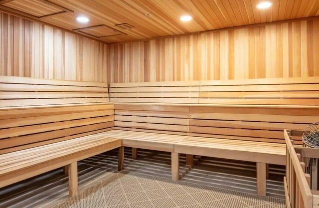 Wooden sauna benches with textured floor Sauna at Muse on Main in Pullman Student Accommodation