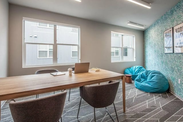 Table chairs laptop bean bags study area at Muse on Main in Pullman Student Accommodation