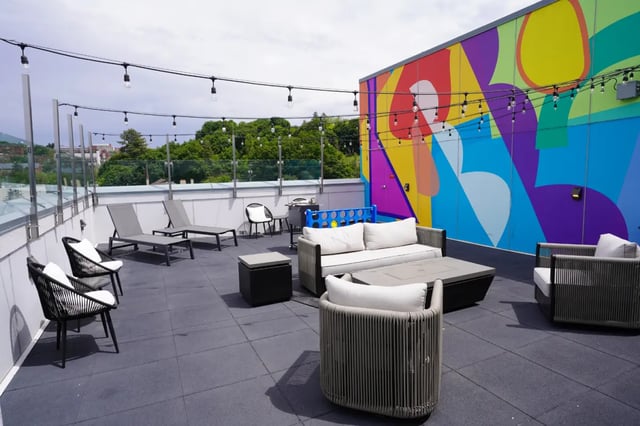 Rooftop seating lounge chairs fire pit outdoor living area at Muse on Main in Pullman Student Accommodation