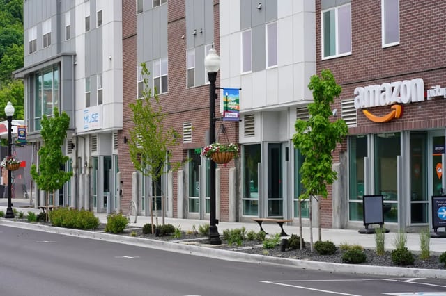 Modern building with trees and Amazon exterior at Muse on Main in Pullman Student Accommodation