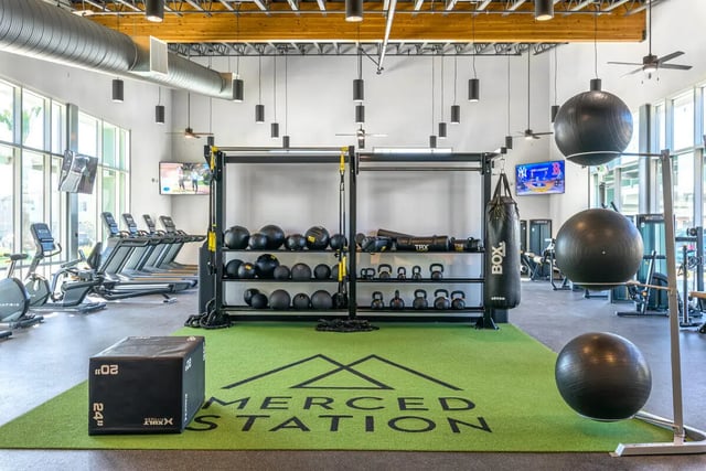 Gym equipment treadmills punching bag weights exercise balls gym. at Merced Station in Merced Student Accommodation