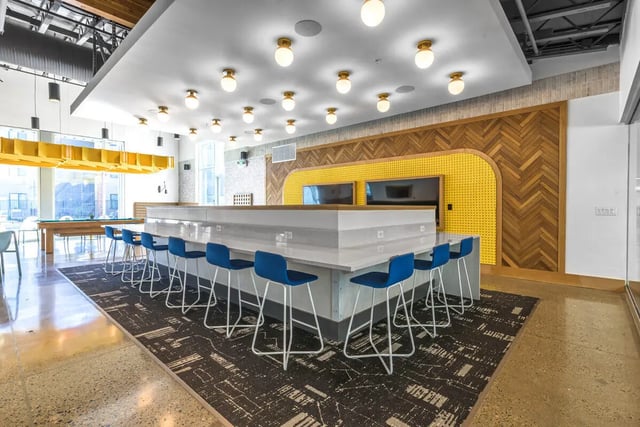 Bar with blue stools and pool table common area at Merced Station in Merced Student Accommodation