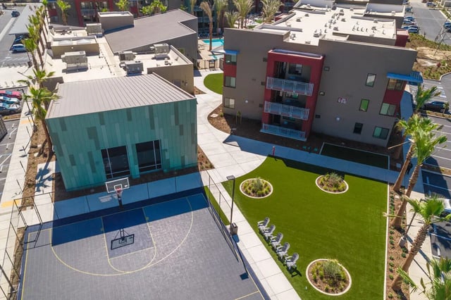 Basketball court and green space exterior at Merced Station in Merced Student Accommodation