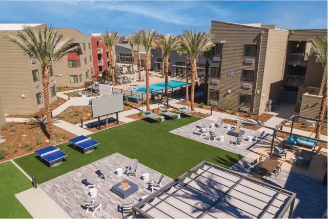 Apartment complex with pool ping pong and lounge areas exterior at Merced Station in Merced Student Accommodation