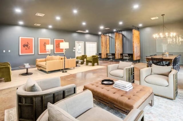 Seating areas with chairs sofas and tables living room at Mustang Village in Wichita Falls Student Accommodation