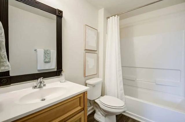 Sink toilet shower tub with curtain Bathroom at Mustang Village in Wichita Falls Student Accommodation