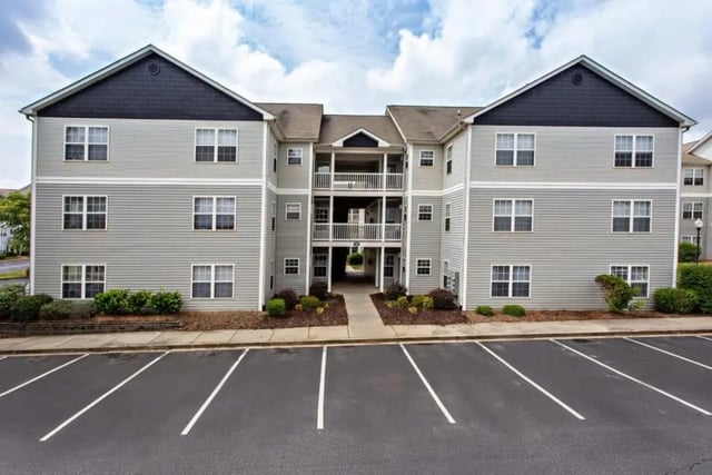 Apartment building with multiple windows exterior at University Village At Clemson in Central Student Accommodation